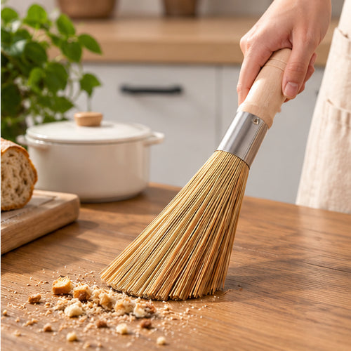 CounterSweep Natural Whisk Broom sweeping crumbs from a countertop